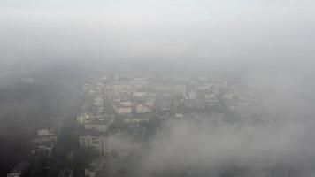 Aerial view of the city in the fog photo