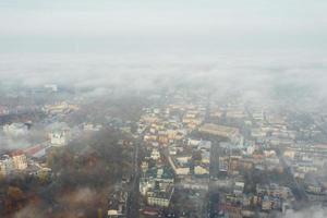 Aerial view of the city in the fog photo