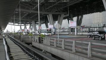 many passenger's car approaching arriving to the platform at departure hall Suvarnabhumi airport reopening country video