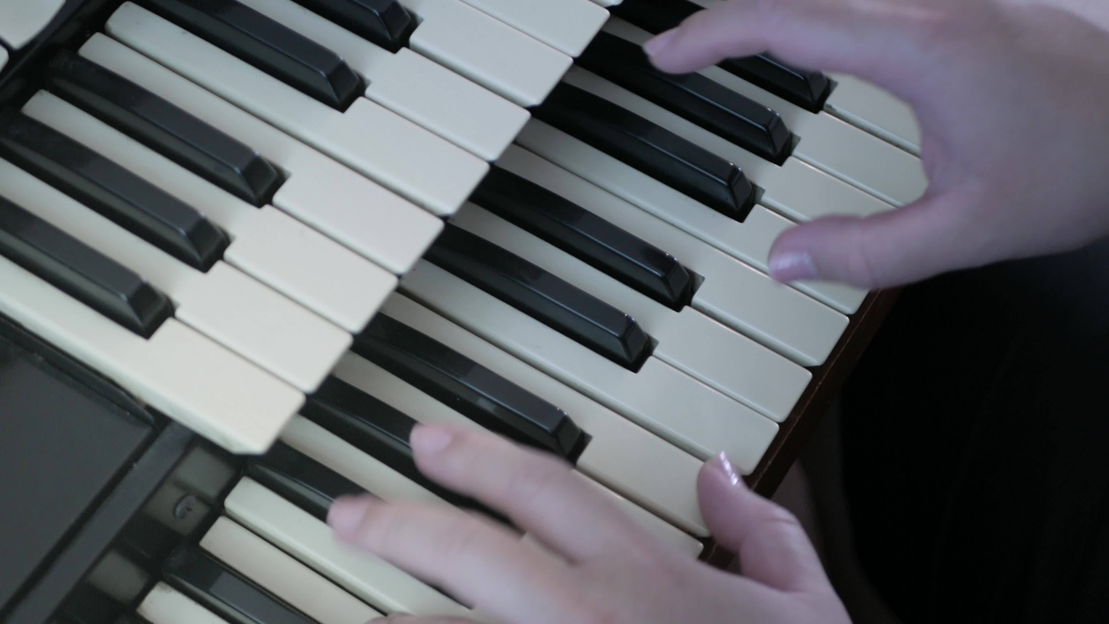 video to the keyboard of piano while using fingers hand playing classic