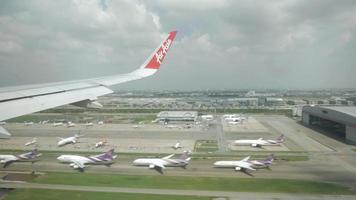 View from inside cabin of airasia airbus a320 plane while approaching to Bangkok Airport video