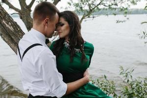 man and woman at the lake photo