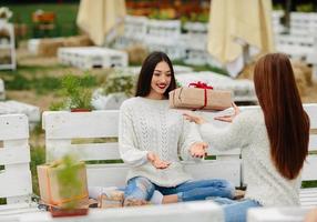 Girls throws gifts to each other photo