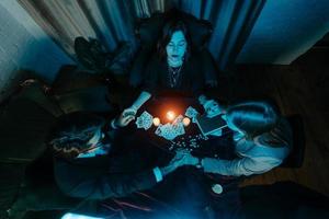 People hold hands of night at table with candles photo