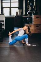 Portrait of attractive young woman doing yoga or pilates exercise photo