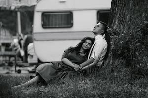 man and woman under a tree photo