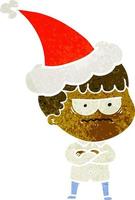 retro cartoon of an annoyed man wearing santa hat vector