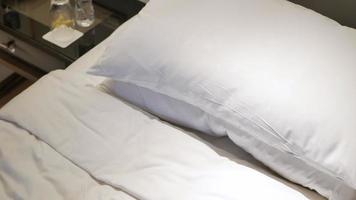 hotel house keeping service brings towels into the bed room put on the bed video