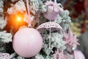 Different object toy gifts hanging on a decorated Christmas tree. photo