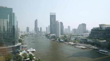 view of Chaophraya River with skyscraper in the city of bangkok in daytime video