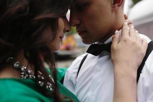 man and woman is hidden from view behind a trailer photo