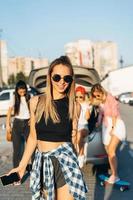 Beautiful young girl in sunglasses posing for the camera. photo