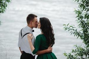 man and woman at the lake photo