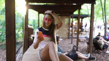 Beautiful young woman on vacation in pink glasses photo