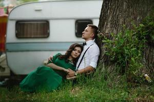 man and woman under a tree photo