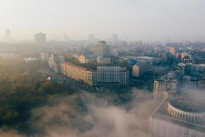 Aerial view of the city in the fog photo