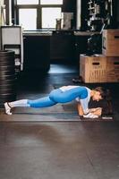 Portrait of attractive young woman doing yoga or pilates exercise photo