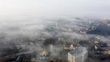 Aerial view of the city in the fog photo