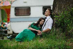 man and woman under a tree photo