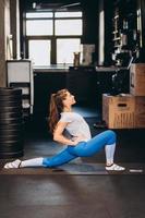 Portrait of attractive young woman doing yoga or pilates exercise photo