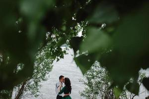 man and woman at the lake photo