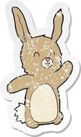 retro distressed sticker of a cartoon happy rabbit vector