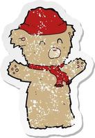 retro distressed sticker of a cartooon teddy bear in hat and scarf vector