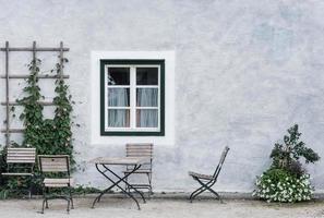 white wall with a window and a place to sit from a castle photo