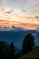 Dawn in the mountains, clouds covered the slopes of the Carpathians. photo