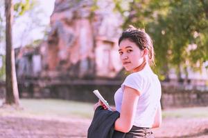 Tourists or archaeologists are exploring the once prosperous Khmer castle. photo