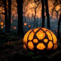 A large orange pumpkin lies on the grass and lanterns burn in the forest photo