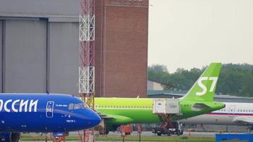 NOVOSIBIRSK, RUSSIAN FEDERATION JUNE 10, 2020 - AviaStar TU Tupolev TU 204 100C airfreighter RA 64051 named Peter the 1st, taxiing to runway for departure. Tolmachevo Airport, Novosibirsk video