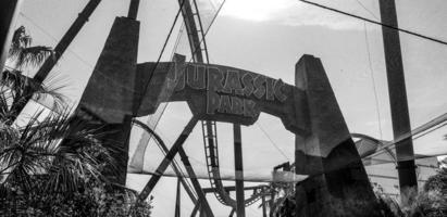 Osaka, Japan on April 9, 2019. Black and white photo of the Jurassic Park ride at Universal Studios Japan.