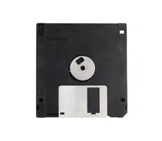 Black 3.5 floppy disk on a isolate white background.Computer devices in the '90s for recording data.top-down,back view,top view,flat lay. photo