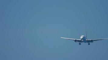 Widebody airplane approaching over ocean before landing in Phuket airport video