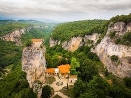 Katskhi pillar with church ruins on top with scenic panorama. Sightseeing landmarks Georgia concept photo