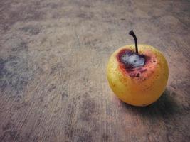 The beautiful yellow texture of the pear even though it is slightly rotten. photo