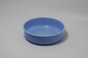 Blue bowl isolated on white background photo