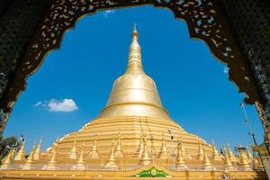 The Shwemawdaw Pagoda is a stupa located in Bago, Myanmar. It is the most tallest pagoda in Myanmar. photo