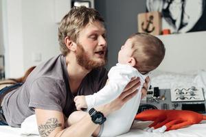 Dad and little son in the bedroom photo