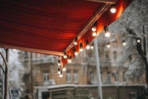 red canopy with a garland on the edge photo