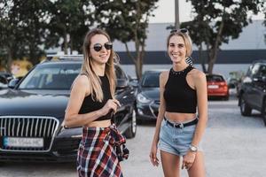 Two young, attractive, sexy girls posing for the camera photo