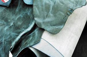 Detailed close up view on samples of cloth and fabrics in different colors found at a fabrics market photo