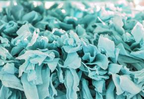 Detailed close up view on samples of cloth and fabrics in different colors found at a fabrics market photo