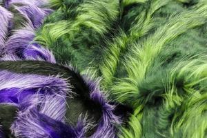 Detailed close up view on samples of cloth and fabrics in different colors found at a fabrics market photo