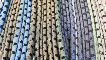 Detailed close up view on samples of cloth and fabrics in different colors found at a fabrics market photo