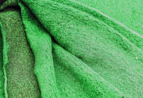 Detailed close up view on samples of cloth and fabrics in different colors found at a fabrics market photo