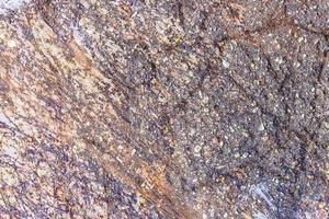 Detailed close up surface of rusty metal and asphalt with lots of corrosion in high resolution photo