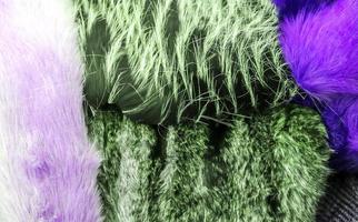 Detailed close up view on samples of cloth and fabrics in different colors found at a fabrics market photo