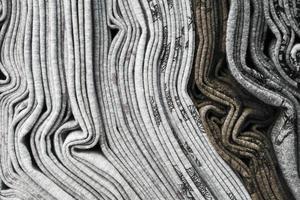 Detailed close up view on samples of cloth and fabrics in different colors found at a fabrics market photo
